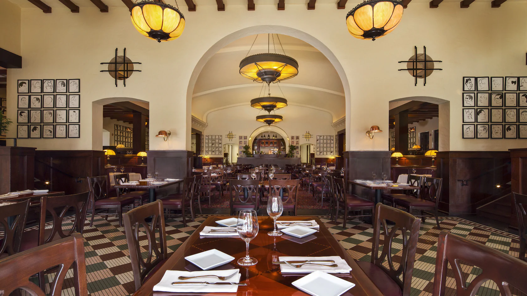 Internal picture of Be Our Guest Restaurant Disney World. Grand dining hall with tables and chairs.